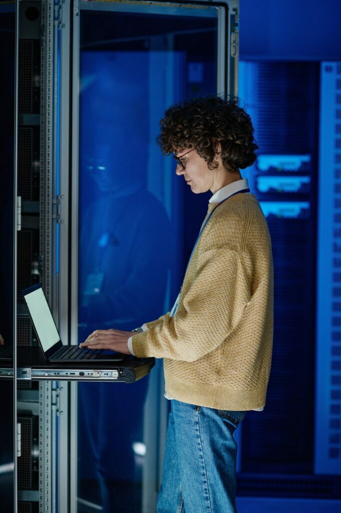 Female IT engineer configuring servers