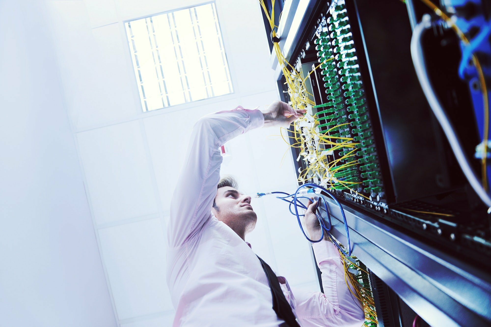 young it engeneer in datacenter server room